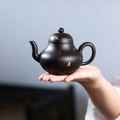 gold black yixing teapot